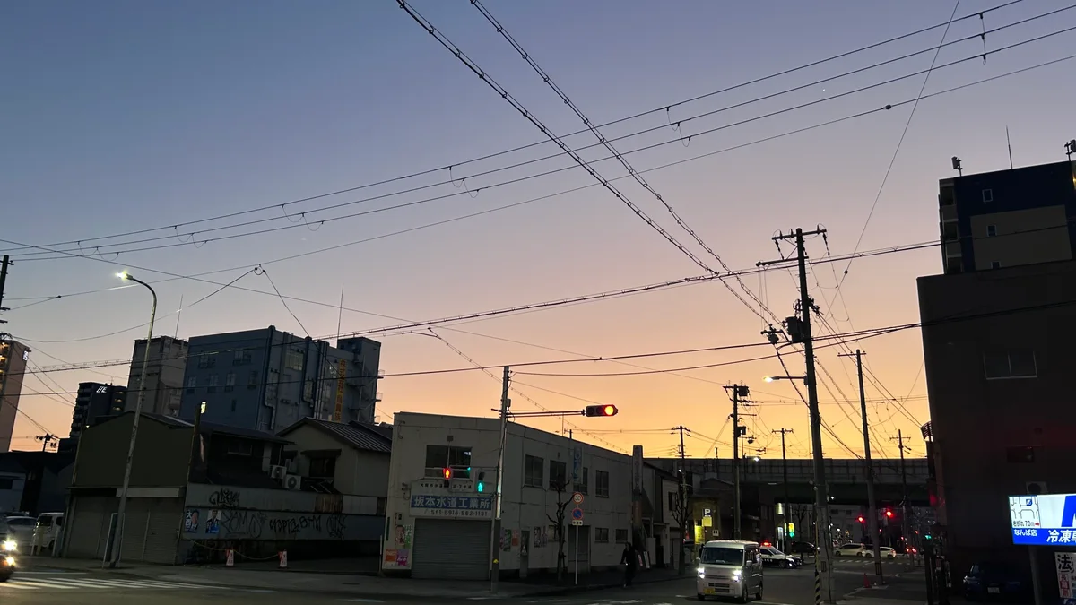 An evening sky above a street in Japan